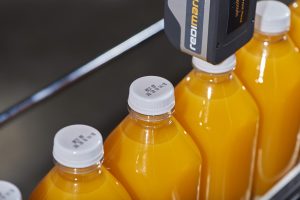 Redimark TC12 thermal inkjet printer mark on plastic orange juice bottle cap. Using T801K ink.